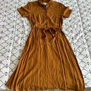 Brown spring/summer dress has pockets in size medium